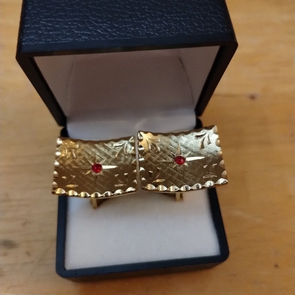 Men's unsigned cuff links with red stone